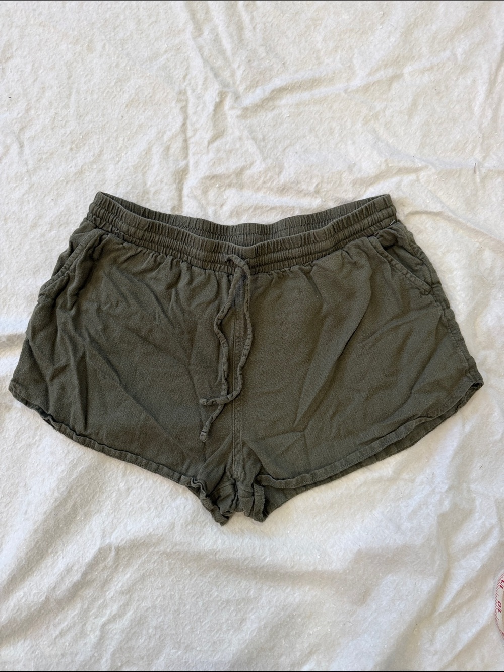Have a lazy summer day in these Olive Drawstring Shorts